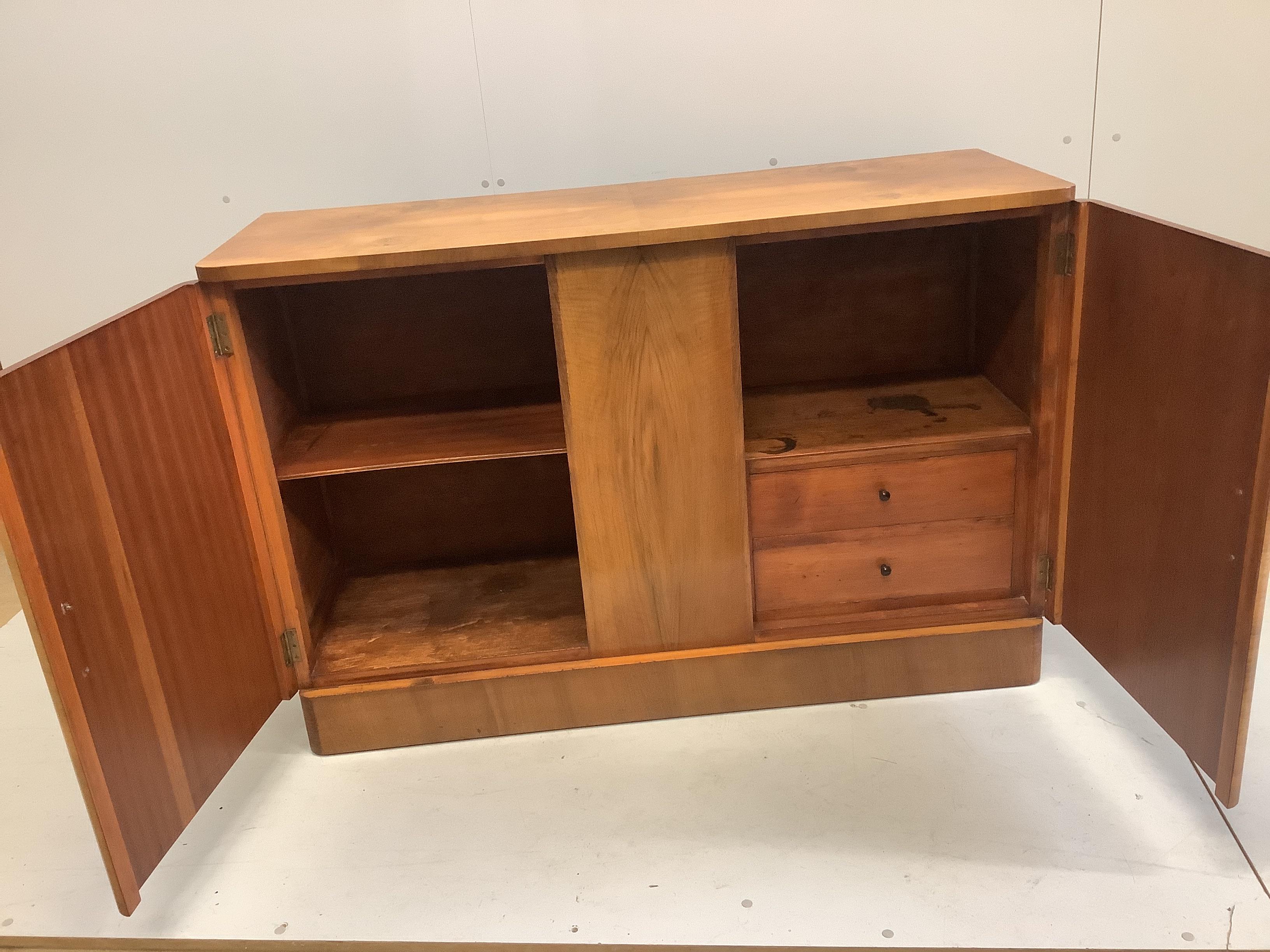 An Art Deco style banded walnut sideboard, width 136cm, depth 48cm, height 90cm